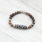 9 Eye Dzi Astrology & Petrified Wood Wrist Mala