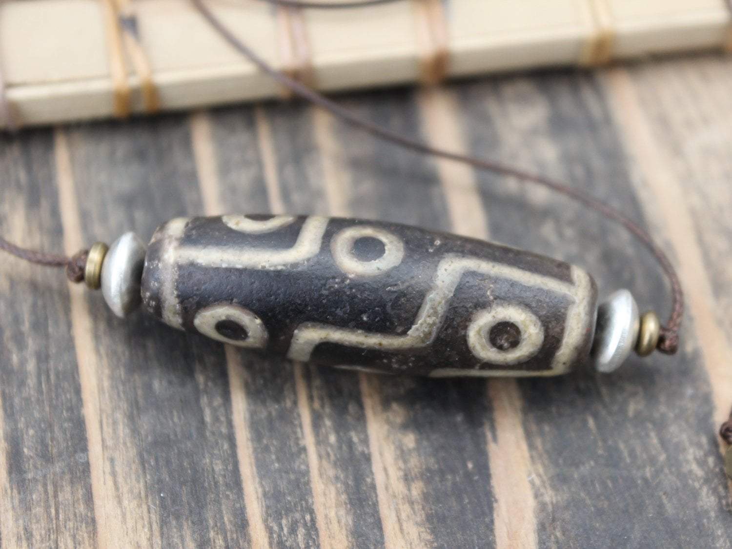 Accumulation of Influence Nine Eye Dzi Bead Necklace