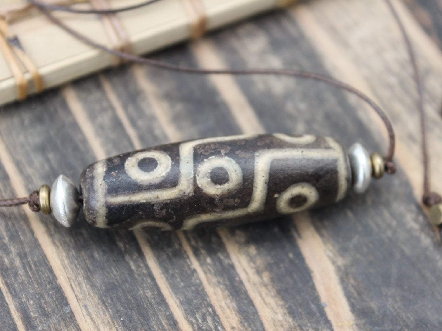 Accumulation of Influence Nine Eye Dzi Bead Necklace