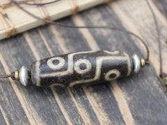 Accumulation of Influence Nine Eye Dzi Bead Necklace